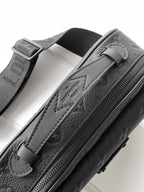 Louis Vuitton monogram crossbody bag, dark leather, close-up of zip pull and embossed logo