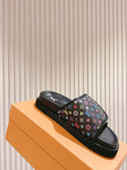 Louis Vuitton slide sandals on box, black monogram upper with multicolor icons