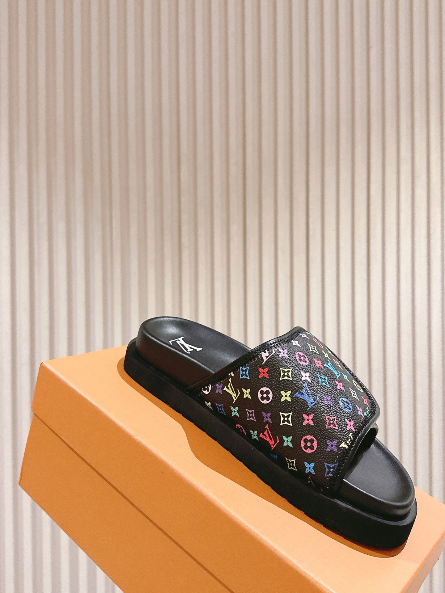 Louis Vuitton slide sandals on box, black monogram upper with multicolor icons