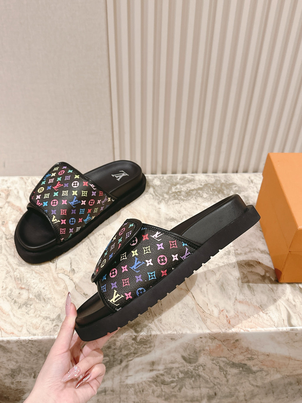 Louis Vuitton slide sandals with black rubber sole and multicolor monogram strap