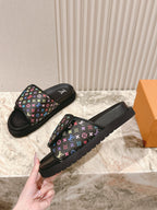Louis Vuitton slide sandals with black rubber sole and multicolor monogram strap