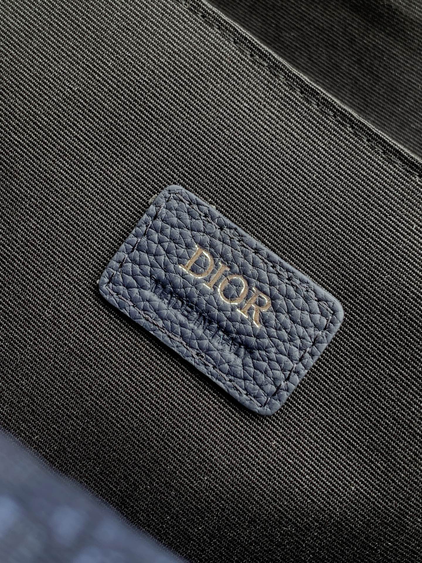 Blue Dior cardholder-style pocket with embossed Dior letters