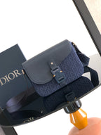 Dior bag with flap and top handle, navy blue textured leather and logo canvas