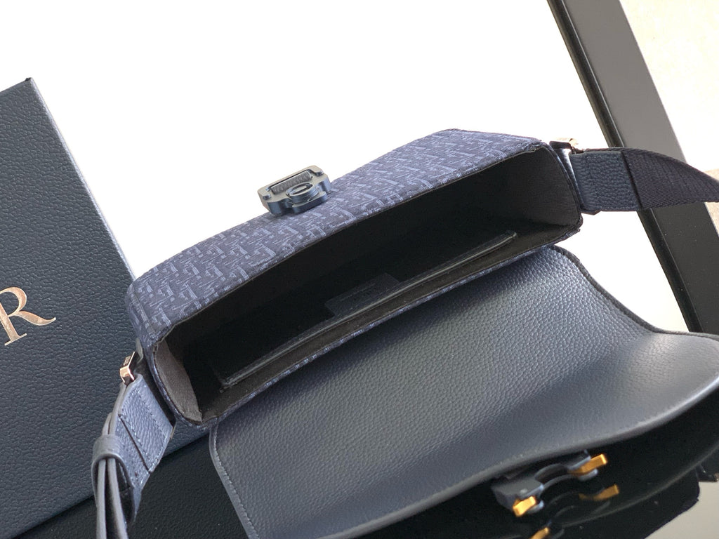 Dior bag interior view, open top with navy flap and adjustable shoulder strap