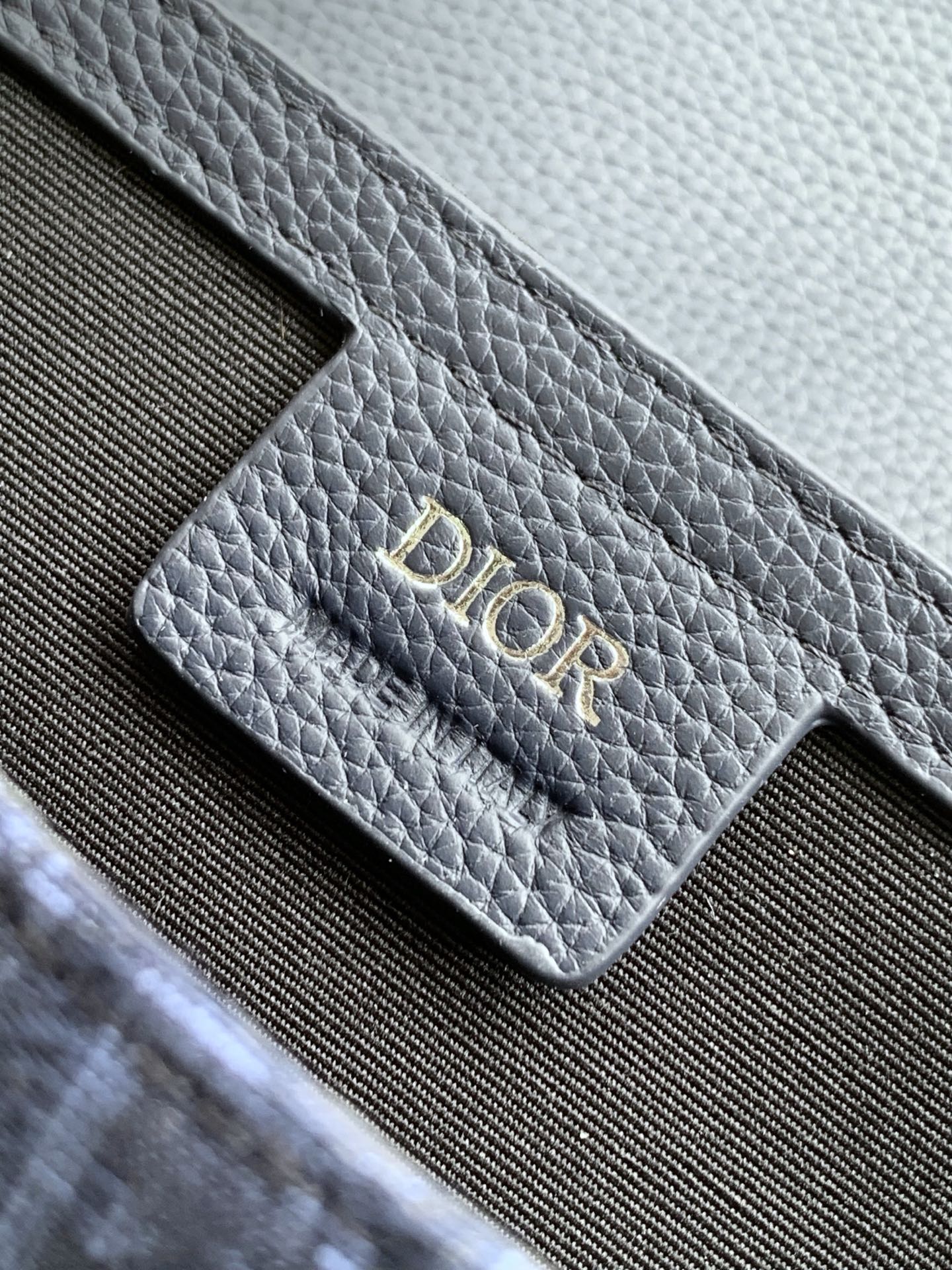 Dior bag strap tab with Dior logo, navy grained leather and monogram fabric
