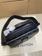 Dark monogram crossbody bag with front zipper and adjustable web strap
