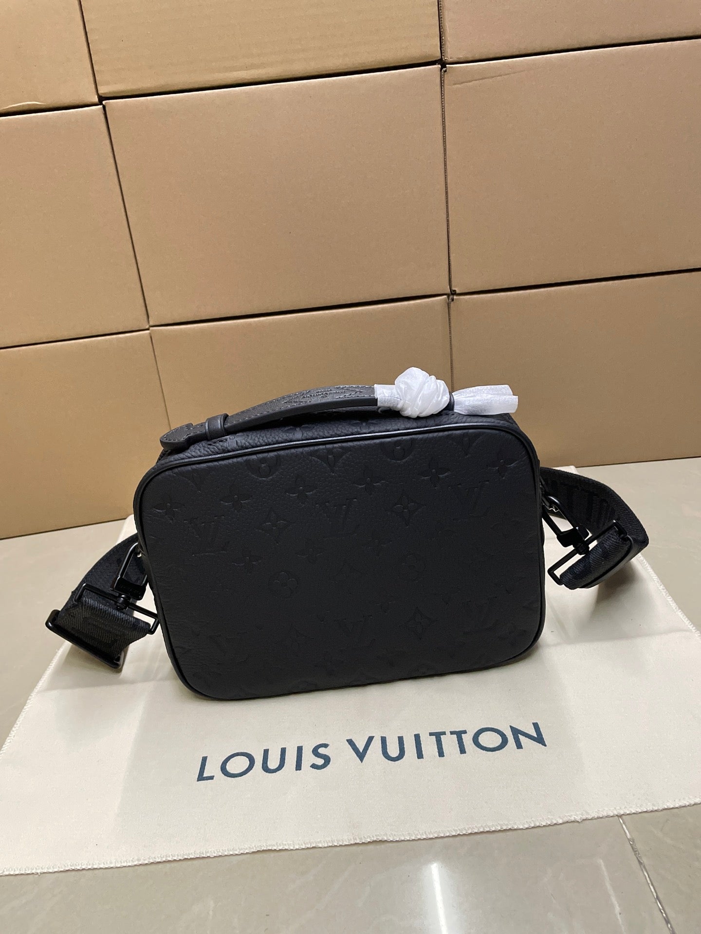 Louis Vuitton men's crossbody bag, dark monogram exterior with shoulder strap