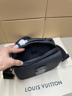 Louis Vuitton men's crossbody bag side view with zip pocket and dark monogram texture