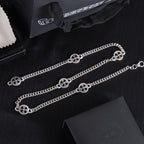 Silver-tone charm bracelet with round wheel bead accents and chain links