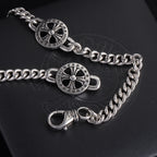 Silver-tone charm bracelet with round wheel charms and lobster clasp