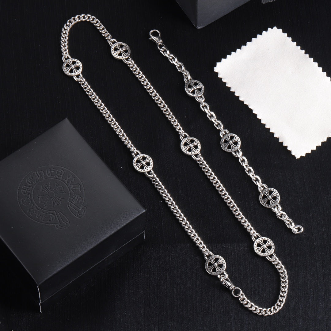 Silver-tone charm bracelet set with round wheel pendants and chain links