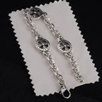 Silver-tone round wheel charm bracelets with chain links and clasp