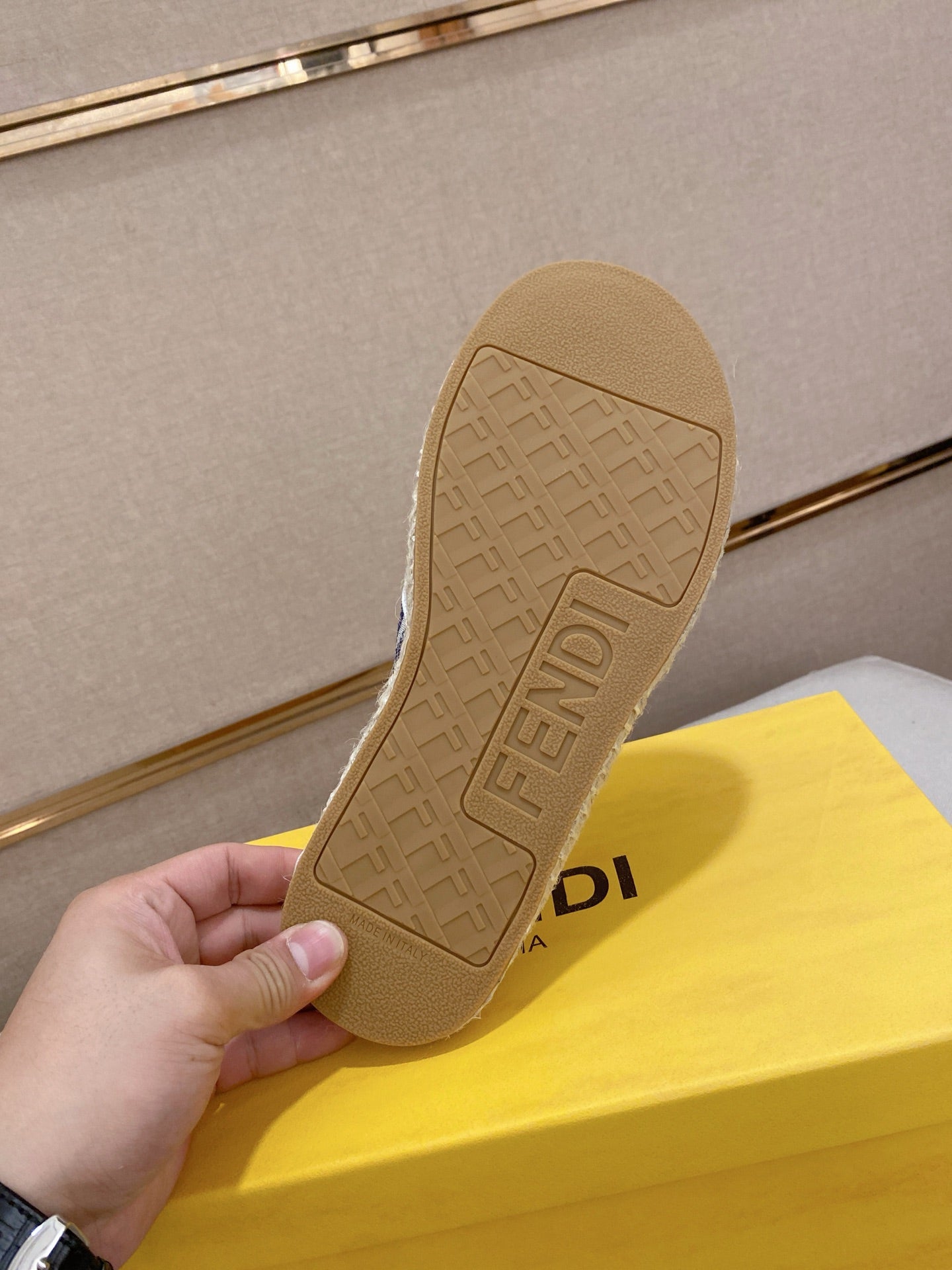 Fendi sandal outsole view, beige rubber sole with embossed Fendi logo