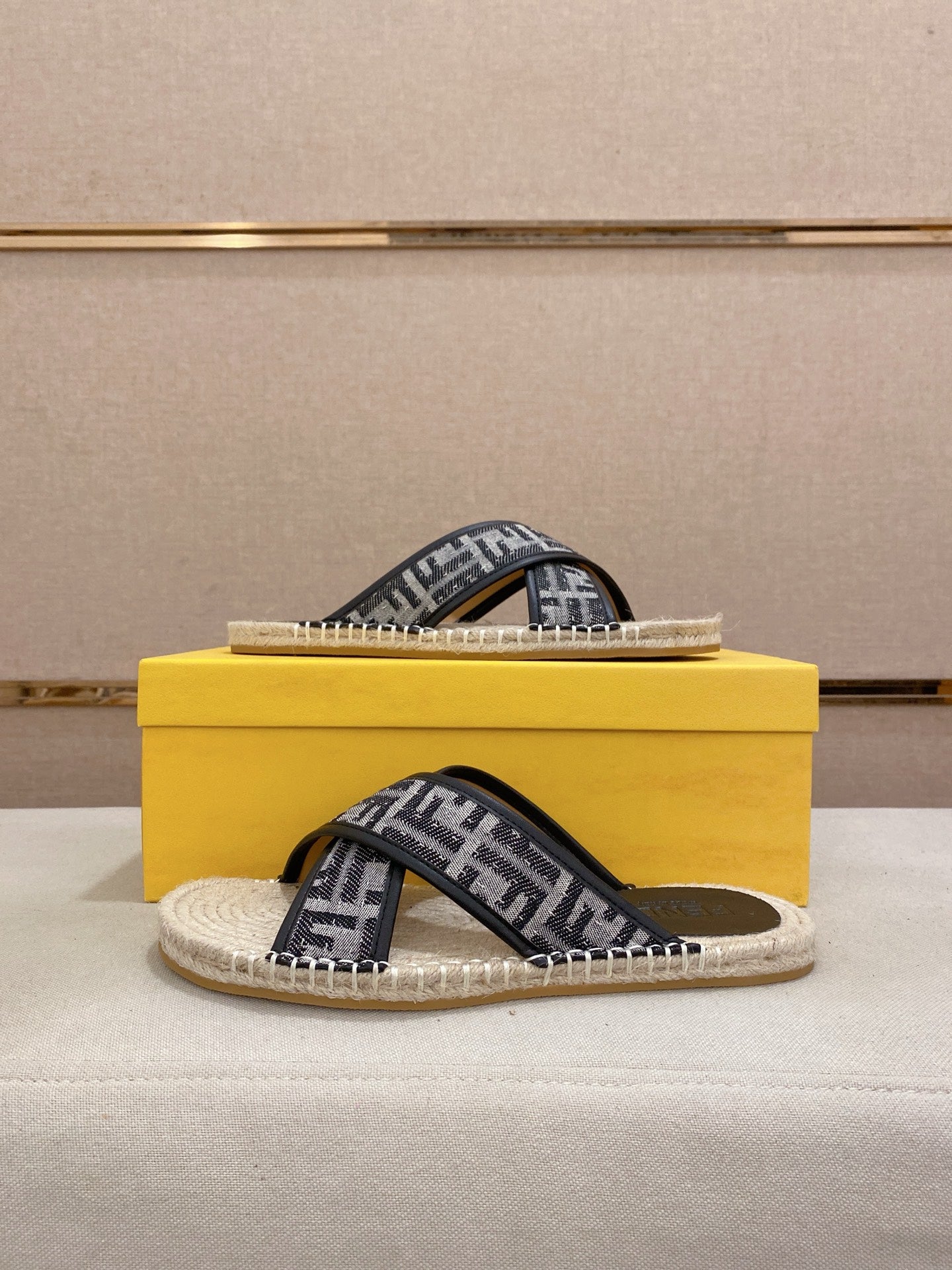 Fendi monogram slide sandals on yellow box, black strap with cream rope sole