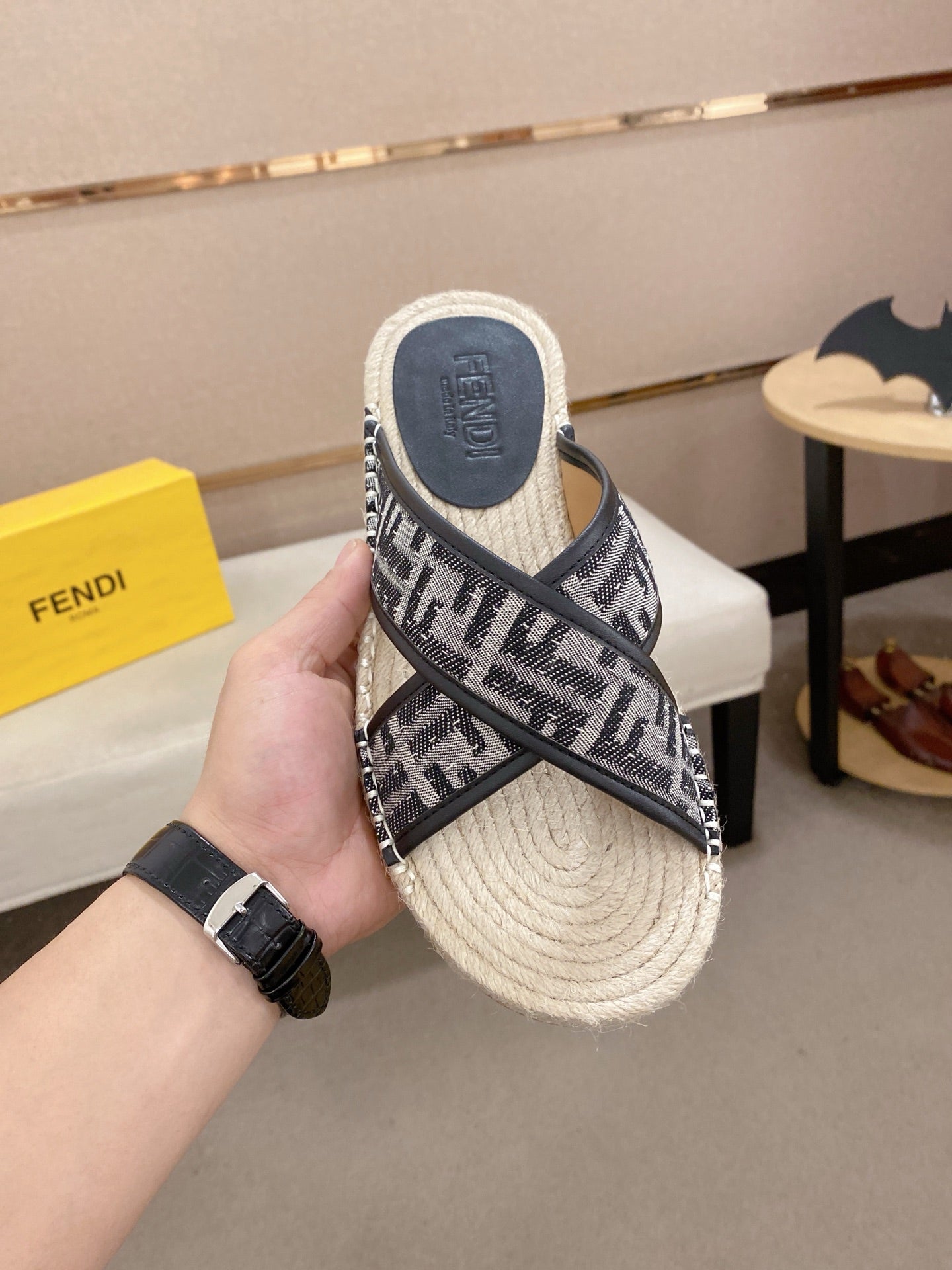 Fendi monogram slide sandals on hand, black strap over cream woven espadrille sole
