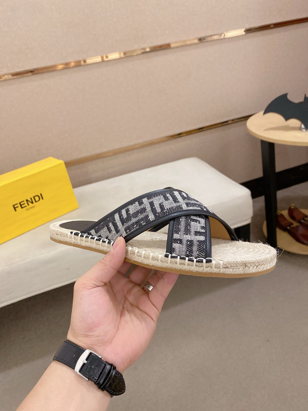 Fendi monogram slide sandals, side view with black strap and cream espadrille sole