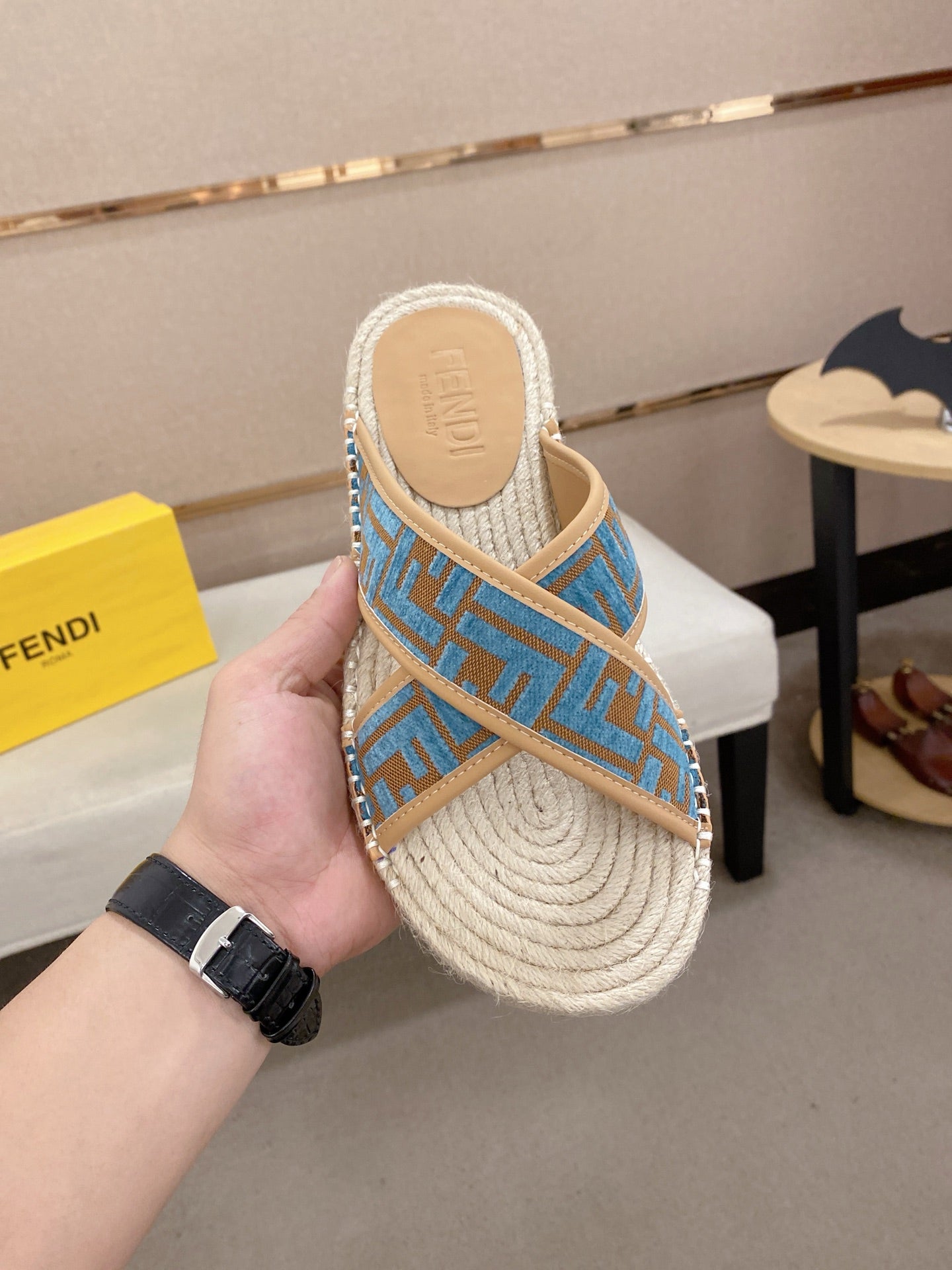 Fendi blue monogram slide sandals with woven footbed, tan outsole, and strap detail