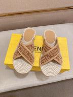 Fendi slide sandals pair with tan F-pattern straps and braided jute-textured footbeds.