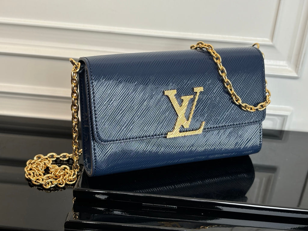Louis Vuitton crossbody bag in navy blue with gold LV logo and chain strap
