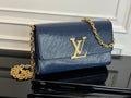 Louis Vuitton crossbody bag in navy blue with gold LV logo and chain strap