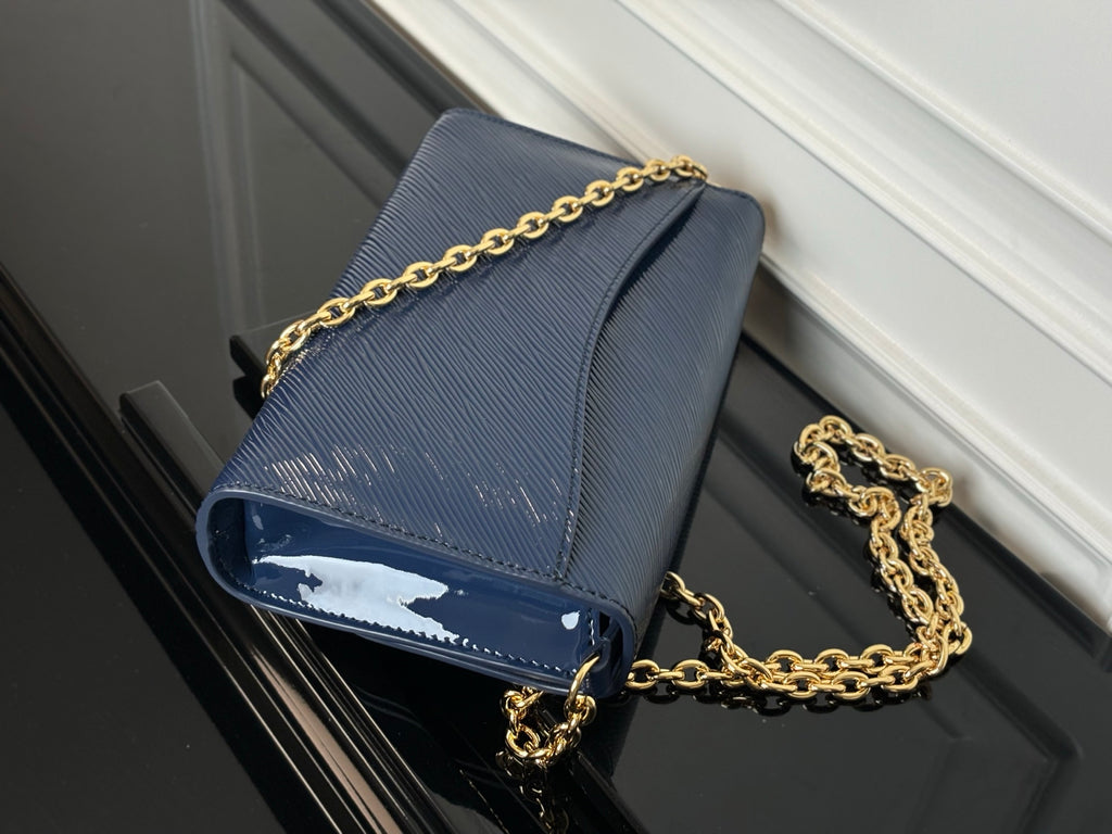 Louis Vuitton crossbody bag navy blue with gold chain strap and flap closure