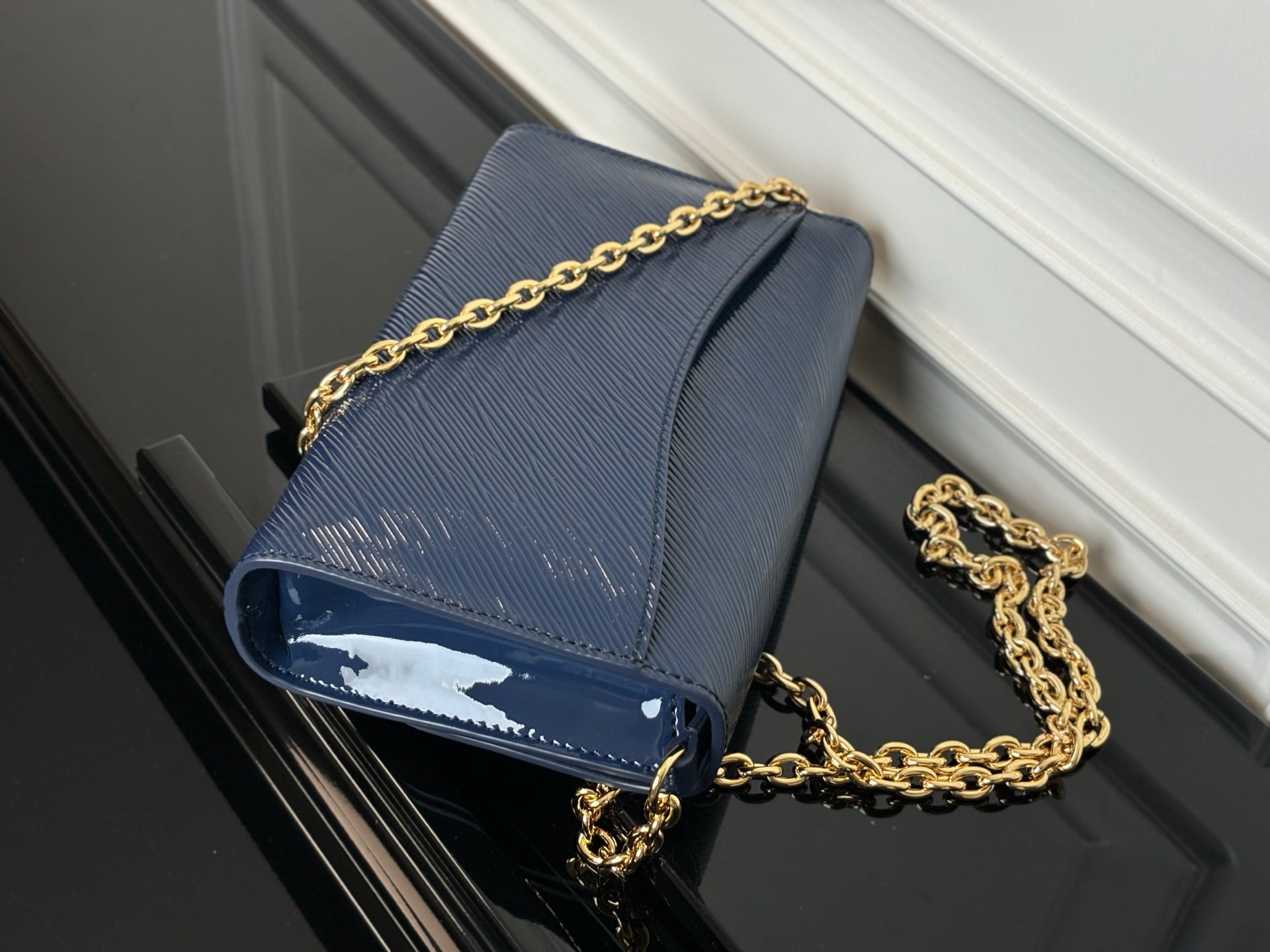 Louis Vuitton crossbody bag navy blue with gold chain strap and flap closure