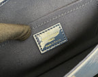 Louis Vuitton Paris made in France leather label on dark interior