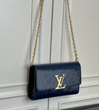 Louis Vuitton crossbody bag navy blue with gold LV logo and chain strap