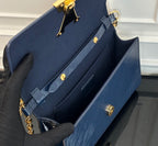 Louis Vuitton bag with open interior view and gold turn-lock hardware