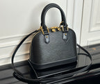 Louis Vuitton top-handle bag in dark with textured finish and gold-tone hardware