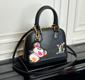 Louis Vuitton top-handle bag in dark with multicolor charm and gold hardware