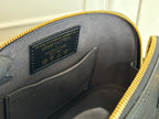 Louis Vuitton engraved interior label on black leather with gold zipper