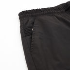 Black shorts close-up of elastic waistband and pocket seam