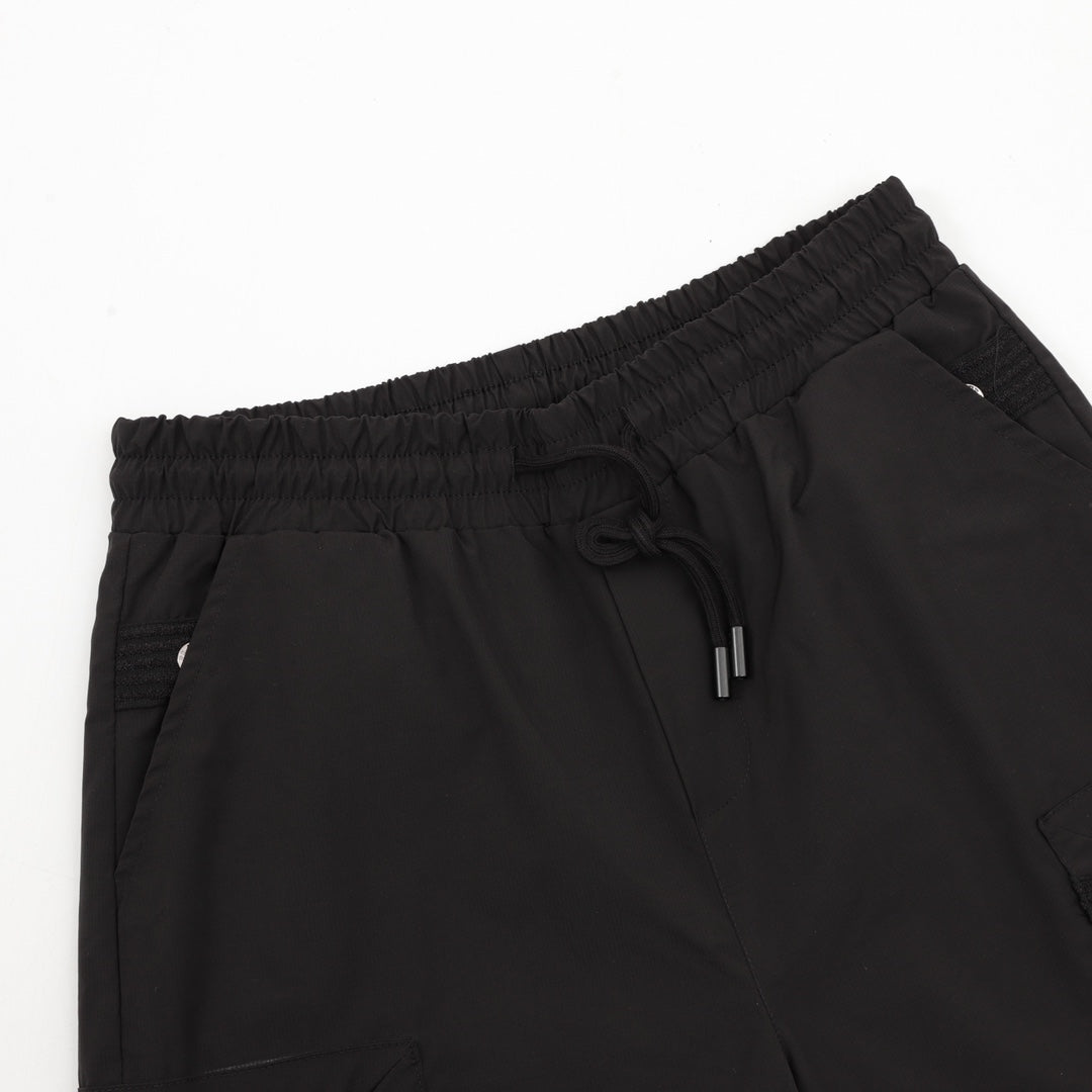 Black Prada shorts with elastic waistband and drawstring tie