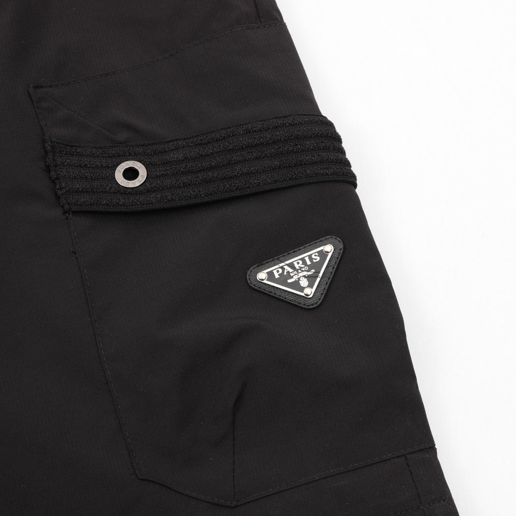 Black shorts with eyelet patch pocket and Prada logo patch