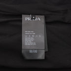 Prada care label on black shorts with size and wash instructions