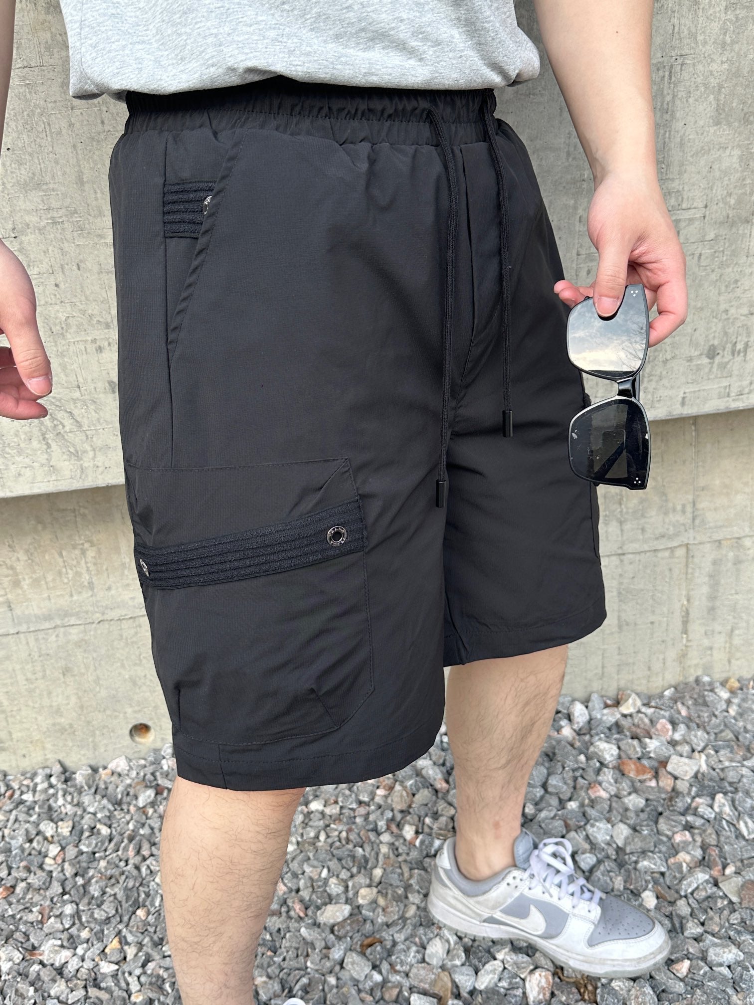 Prada black cargo shorts with elastic waistband and front buttoned pockets