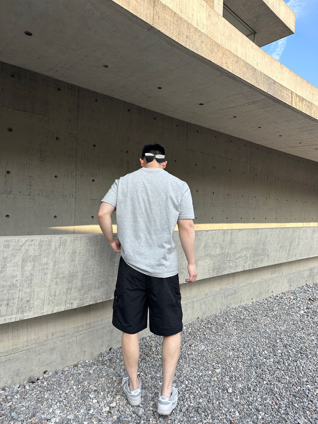 Prada black cargo shorts, back view with elastic waistband