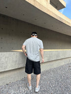 Prada black cargo shorts, back view with elastic waistband