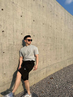 Prada black cargo shorts with drawstring waist and side pocket panels