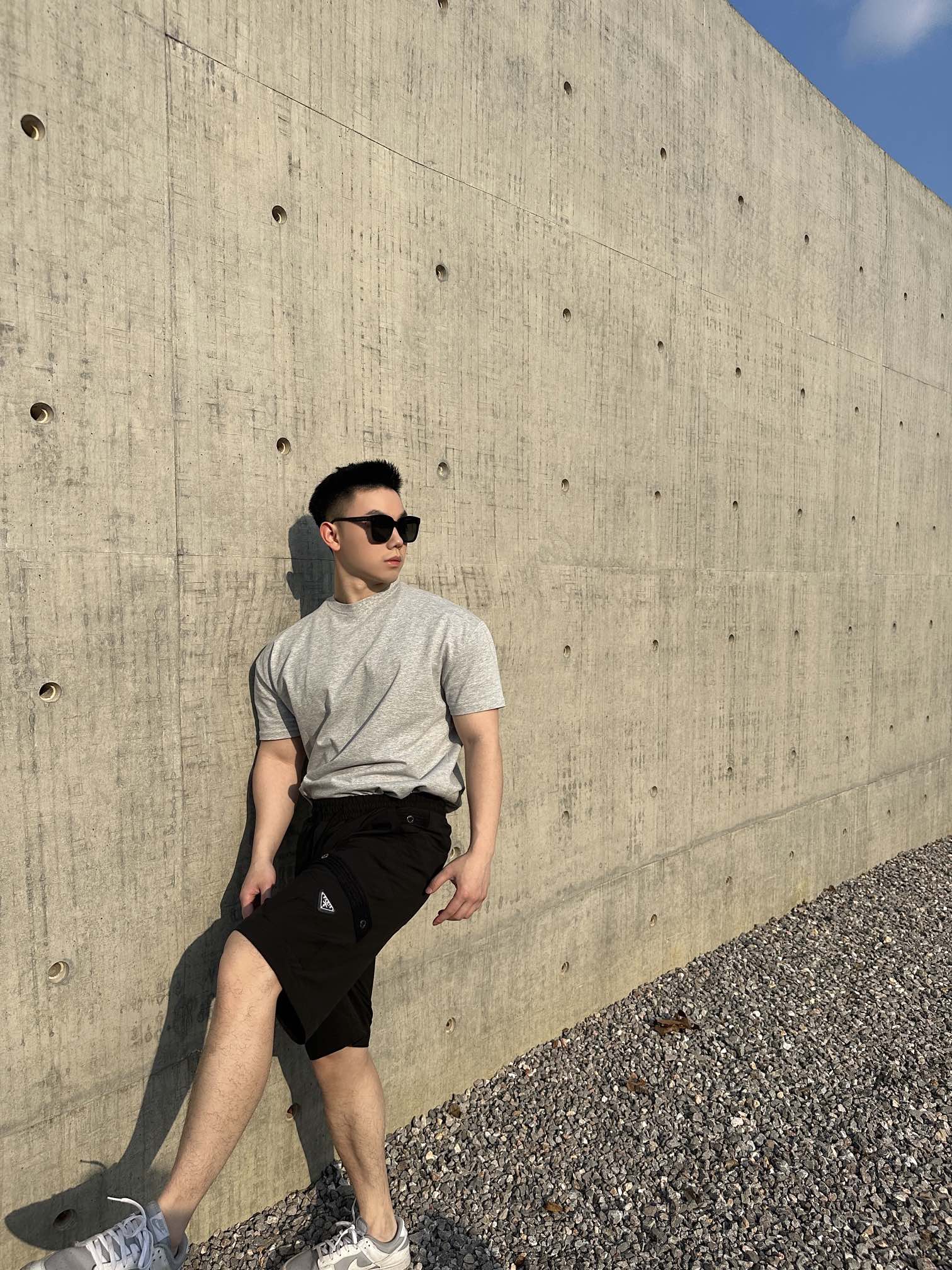 Prada black cargo shorts with drawstring waist and side pocket panels