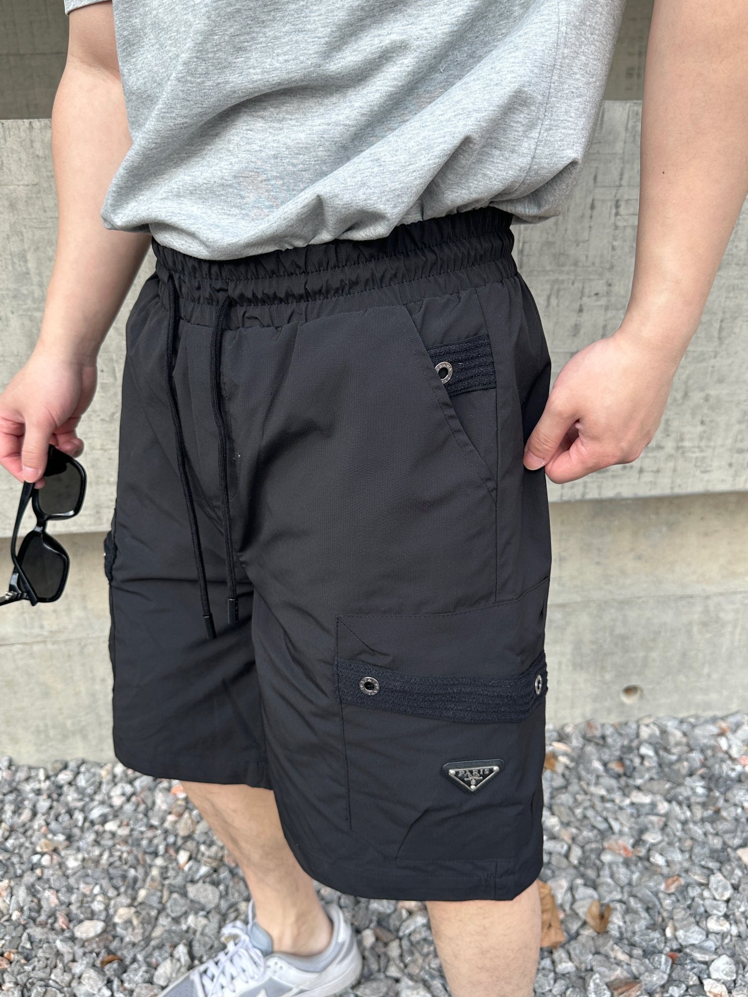 Prada black cargo shorts with button pocket and adjustable belt detail