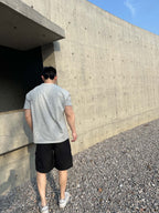 Prada black cargo shorts, rear view with drawstring waist