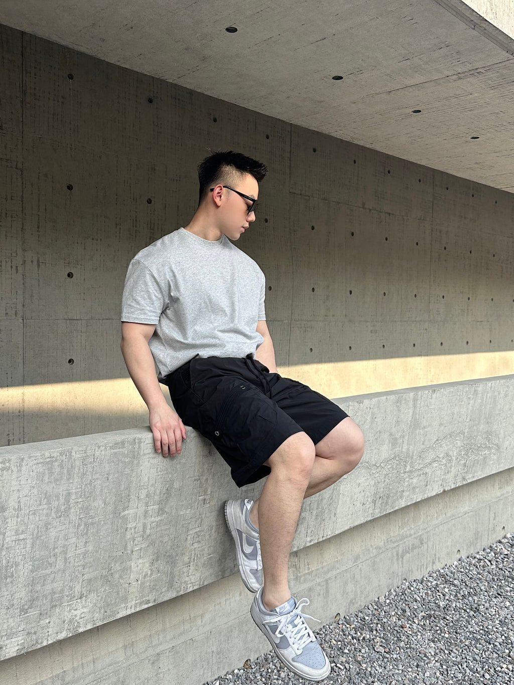 Prada black cargo shorts with drawstring waist and knee-length fit