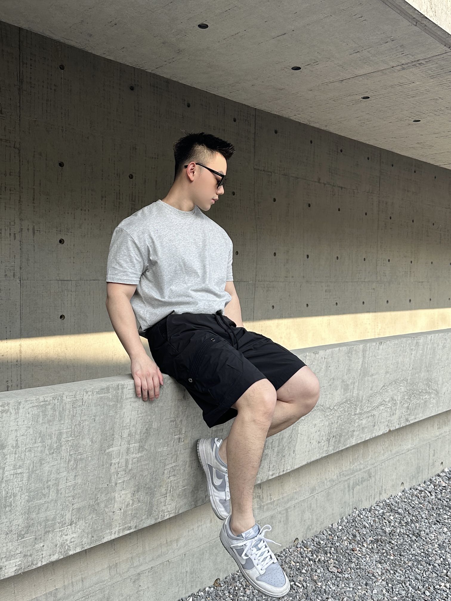 Prada black cargo shorts with drawstring waist and knee-length fit