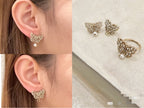 Dior gold-tone butterfly stud earrings with pearl drop