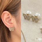 Gold butterfly earrings with white pearl and crystal embellishment