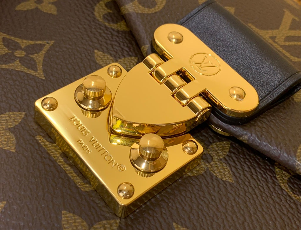 Louis Vuitton monogram bag clasp hardware with gold plate and snap latch