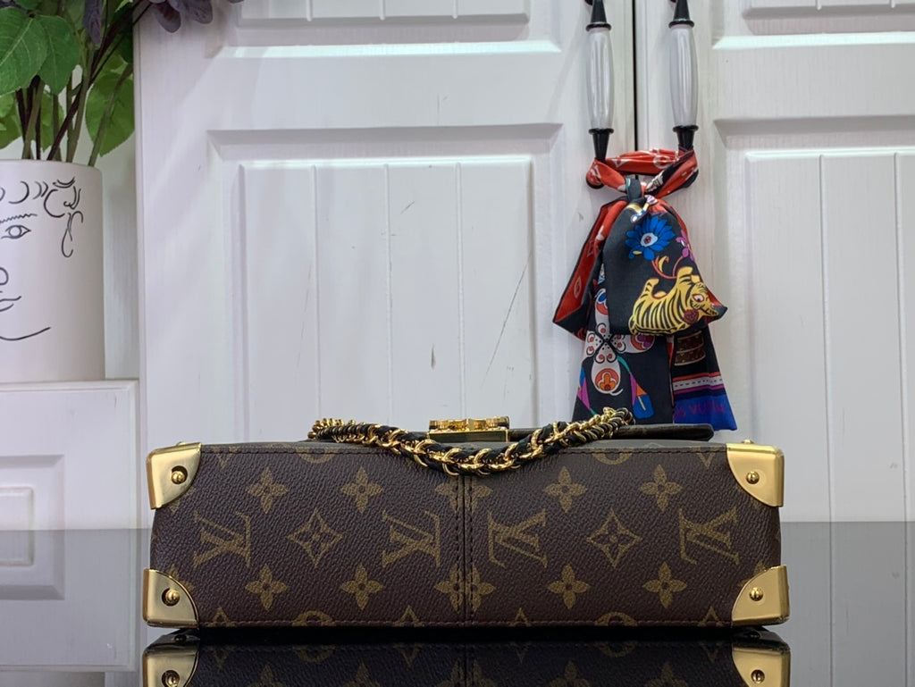 Louis Vuitton monogram bag top view with chain straps and clasp hardware