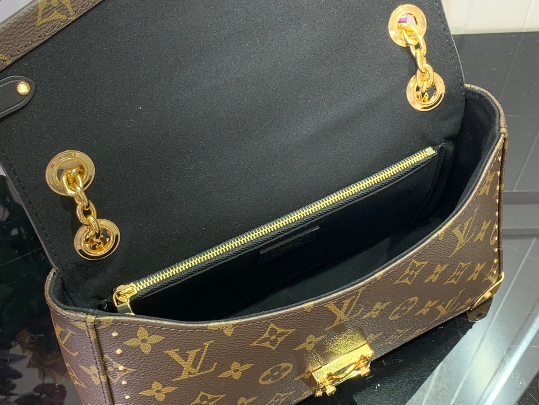 Louis Vuitton monogram bag open top showing black interior and gold zipper